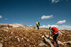 couple and dog hiking Gore Range